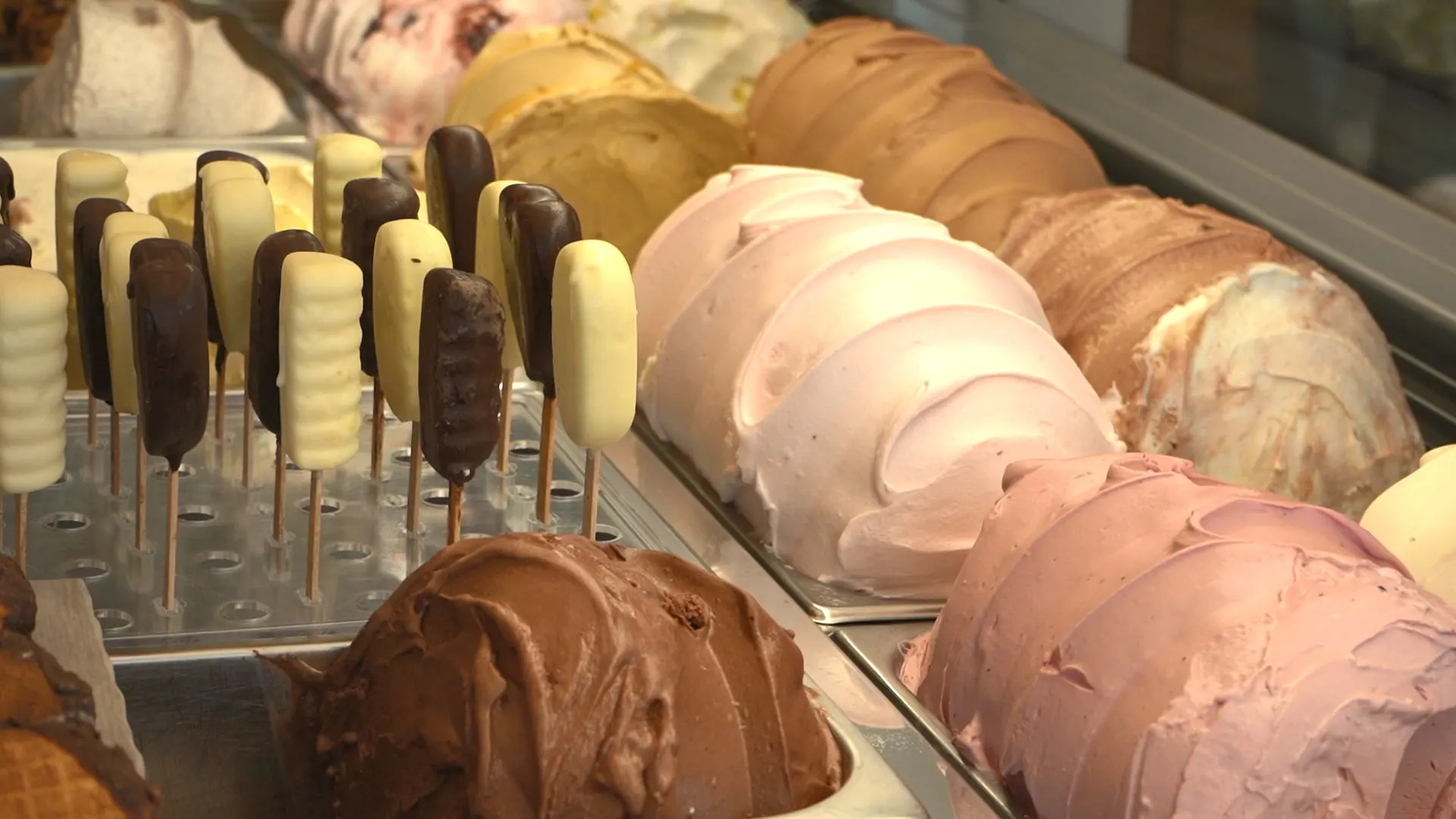 Gelato pans and gelato pops in a display case