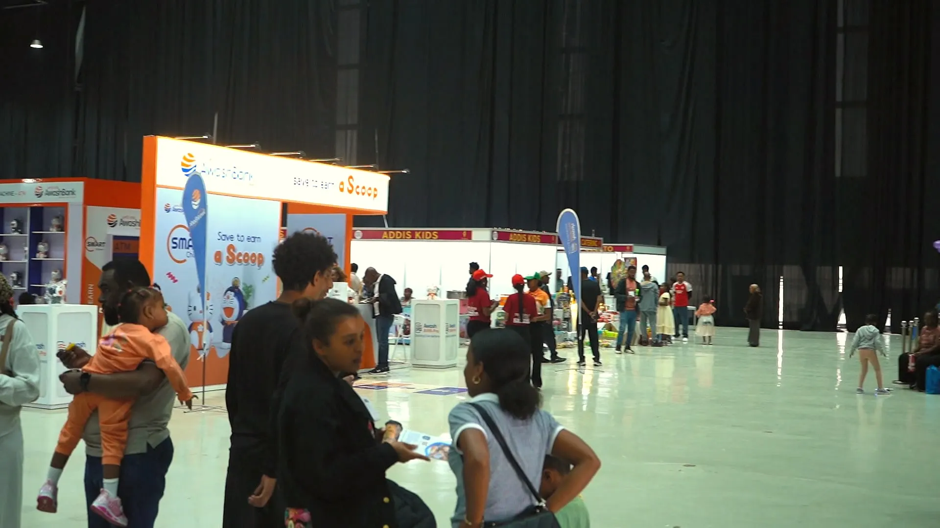 A family walking through the festival hall