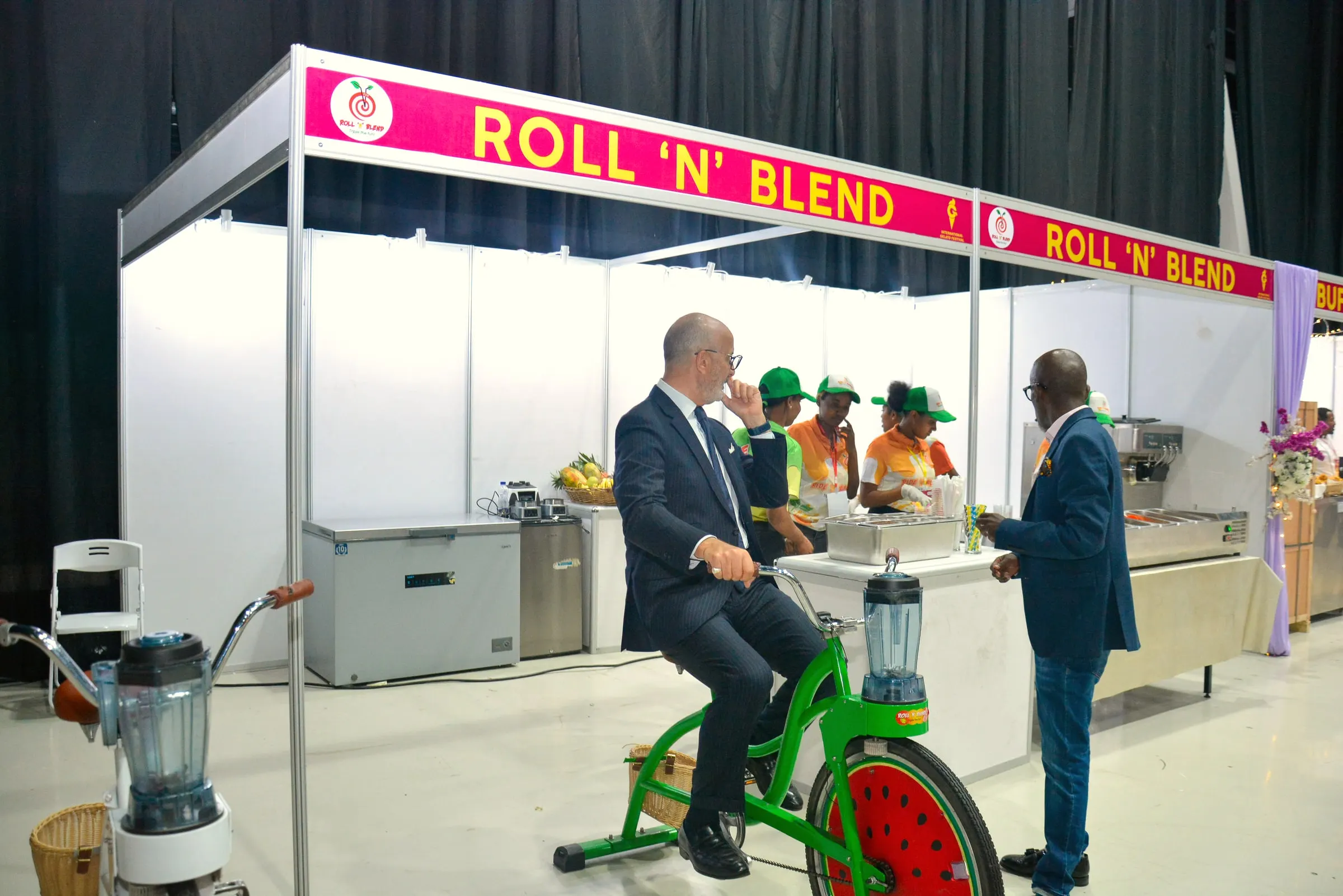 Guests riding a blender bike at the Roll ’N’ Blend booth
