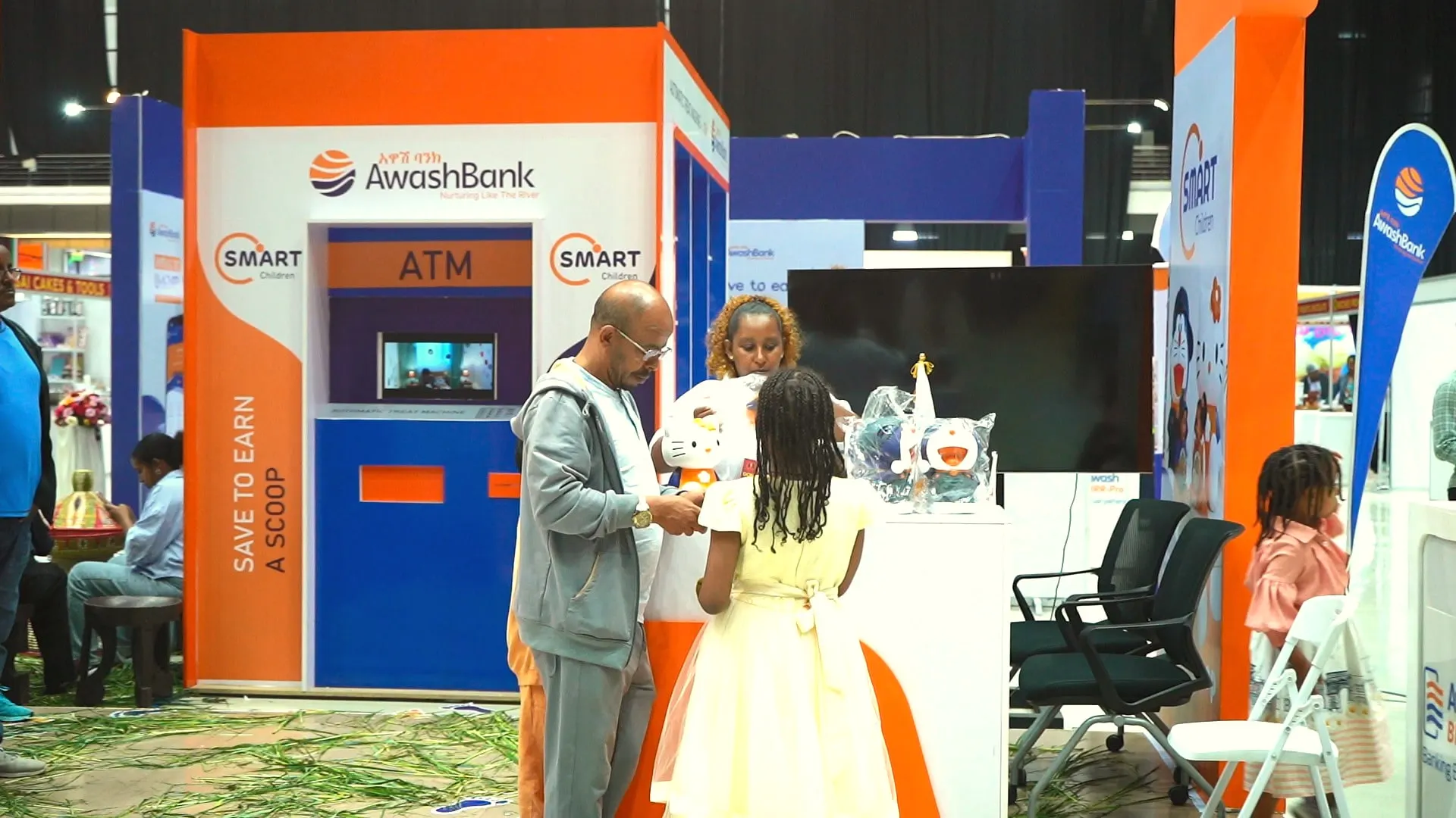 Families at the Awash Bank “treat ATM” booth