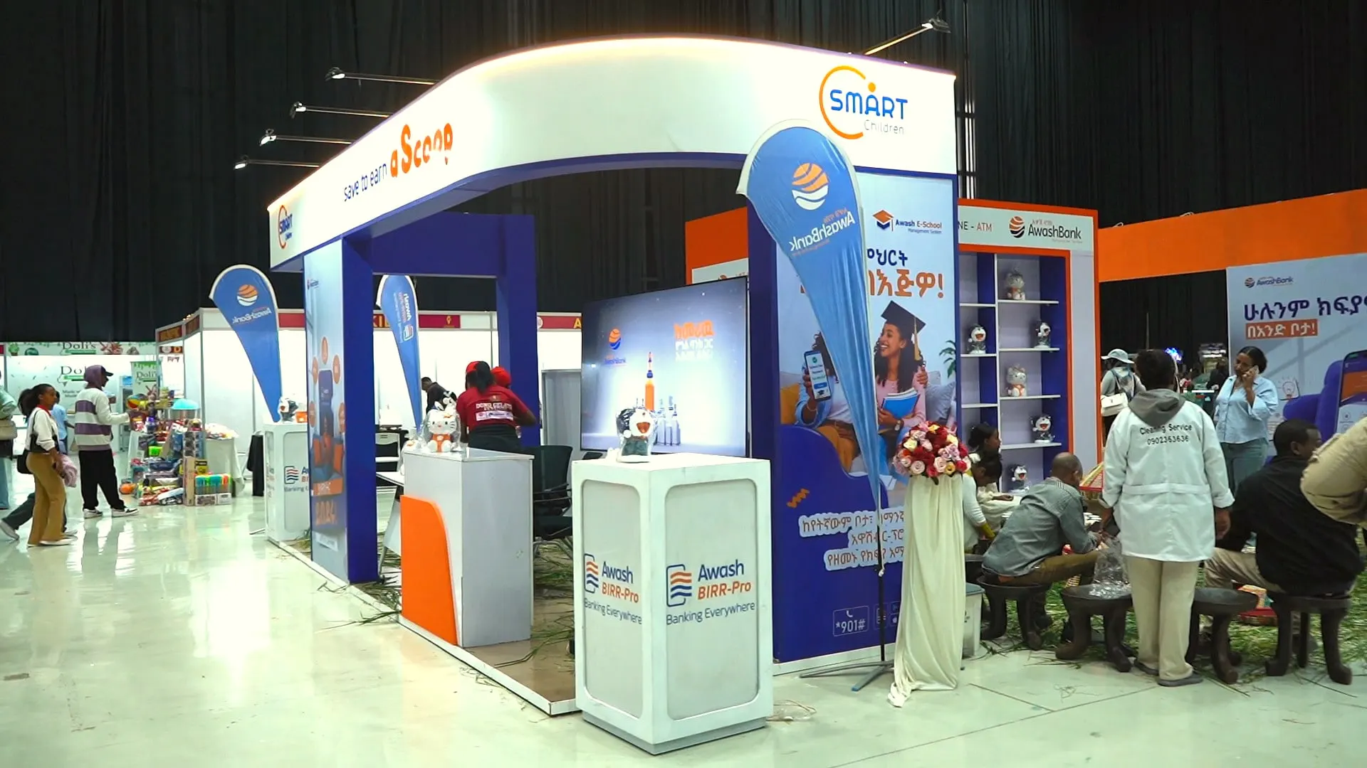 Sponsor booth with blue and orange branding